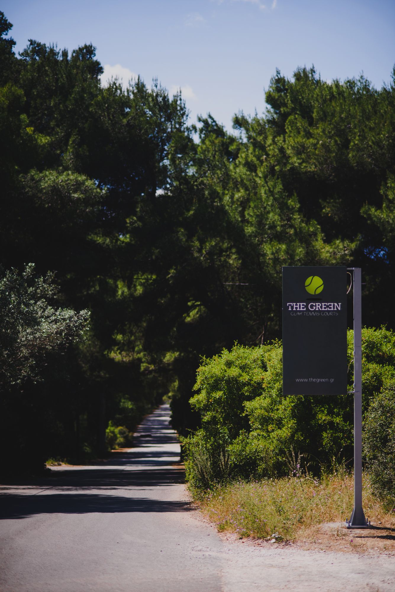 The Green sign on a tree-lined lane in Ekali